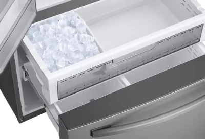 Fresh ice cubes inside the freezer drawer of a Samsung Bespoke refrigerator.