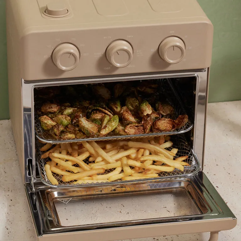 Wonder Oven beside deep fryer, skillet, batter and whole chicken